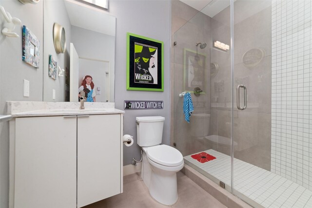 1807 Prospect St, Houston, TX 77004 - bathroom featuring toilet, a stall shower, vanity, and tile patterned floors