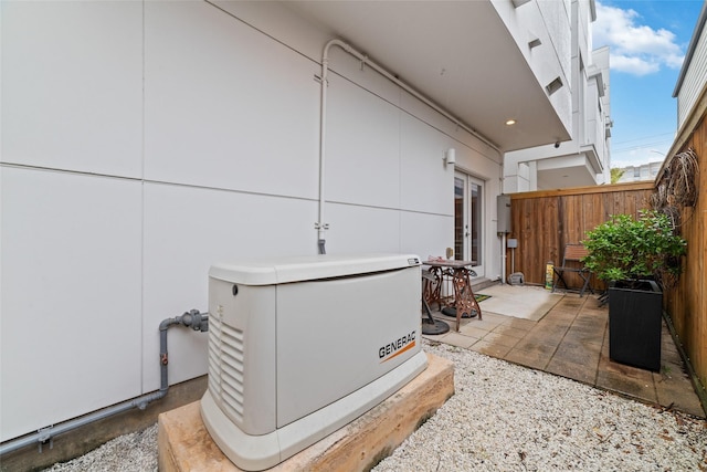 exterior details featuring french doors, fence, and a power unit