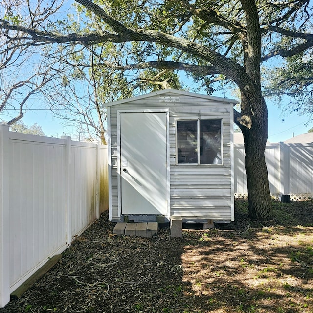 view of shed featuring a fenced backyard