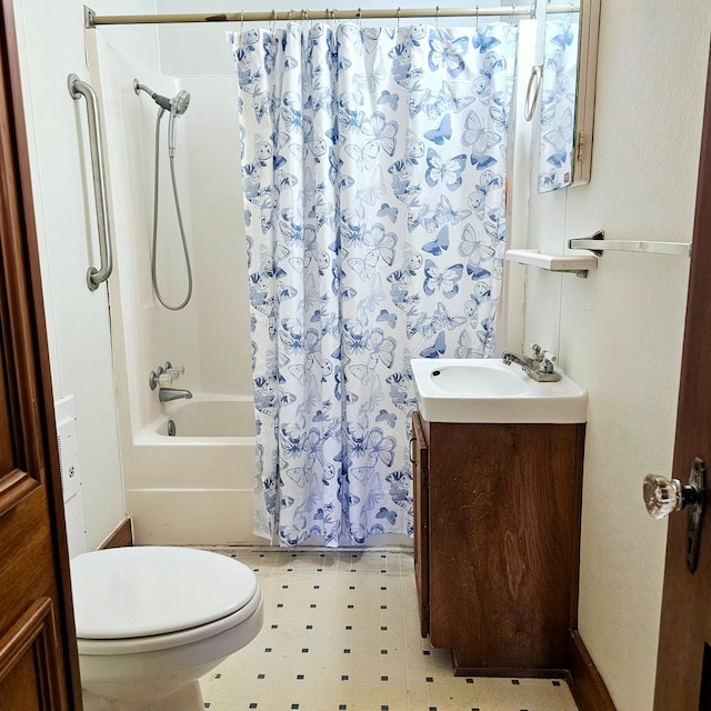 bathroom featuring shower / tub combo, vanity, toilet, and tile patterned floors