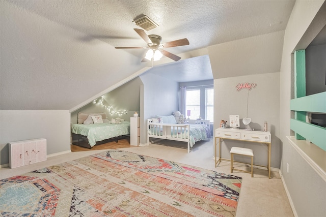1731 Red Oak Ter, Houston, TX 77339 - bedroom with a textured ceiling, vaulted ceiling, a ceiling fan, carpet, and baseboards