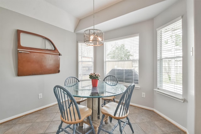 1731 Red Oak Ter, Houston, TX 77339 - dining area featuring plenty of natural light, a chandelier, tile patterned flooring, and lofted ceiling