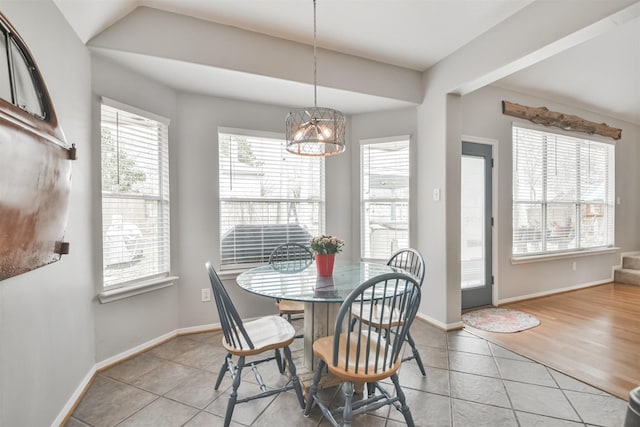 dining area with light tile patterned floors and baseboards