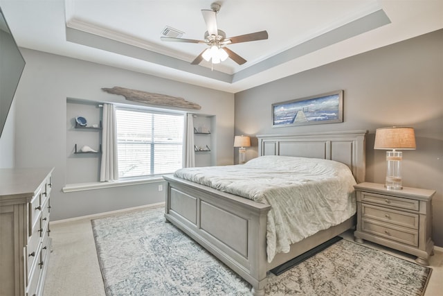 1731 Red Oak Ter, Houston, TX 77339 - bedroom with a tray ceiling, baseboards, crown molding, light colored carpet, and a ceiling fan