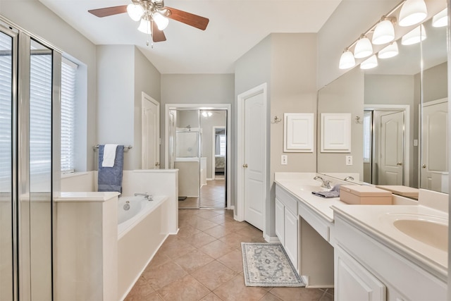 1731 Red Oak Ter, Houston, TX 77339 - full bathroom featuring a ceiling fan, double vanity, a bath, and tile patterned flooring