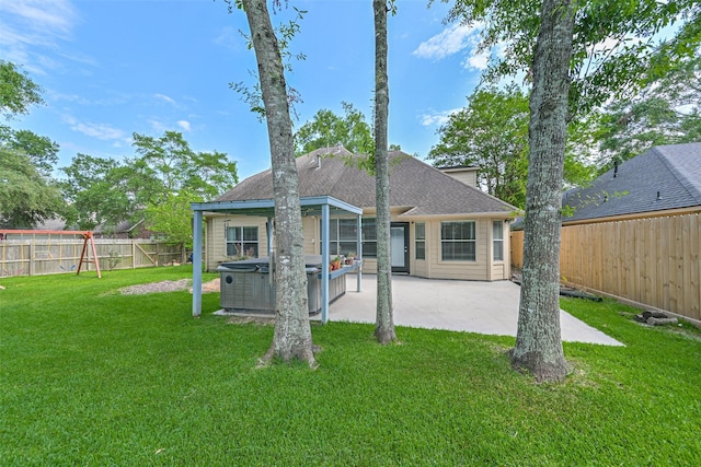 1731 Red Oak Ter, Houston, TX 77339 - back of house with a hot tub, a patio area, and a shingled roof
