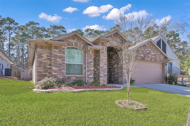 ranch-style home featuring a garage, brick siding, and a front lawn