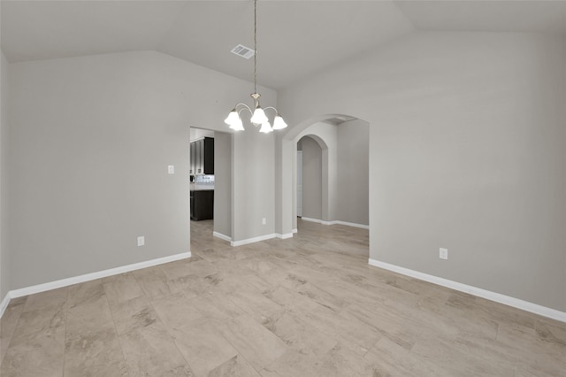 empty room with arched walkways, lofted ceiling, visible vents, a chandelier, and baseboards