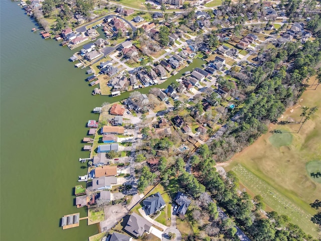 bird's eye view featuring a water view and a residential view