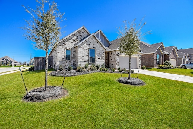 view of front facade featuring a front lawn, driveway, a residential view, an attached garage, and brick siding