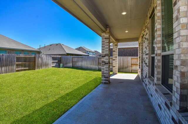 view of yard with a fenced backyard and a patio