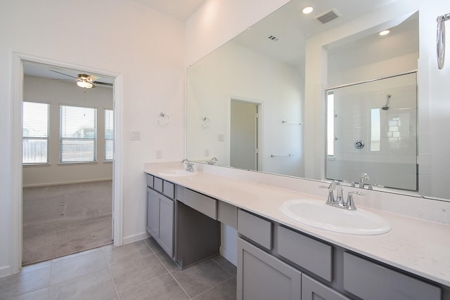 full bathroom featuring double vanity, visible vents, a ceiling fan, and a sink