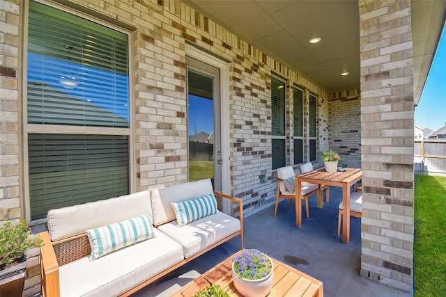 view of patio / terrace with an outdoor living space and covered porch