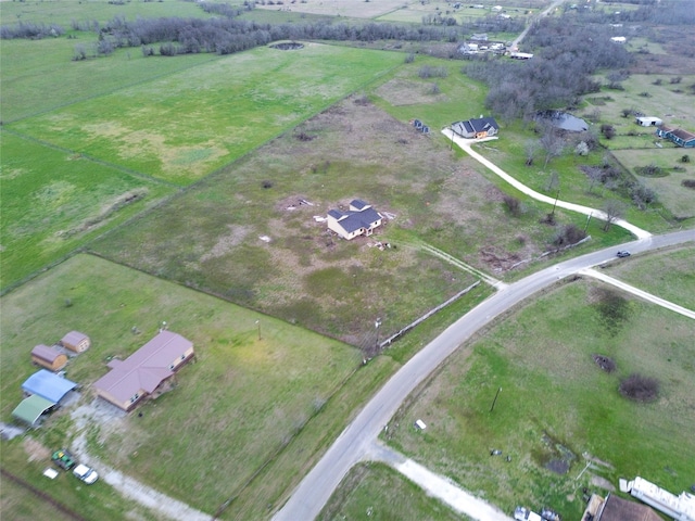 birds eye view of property featuring a rural view