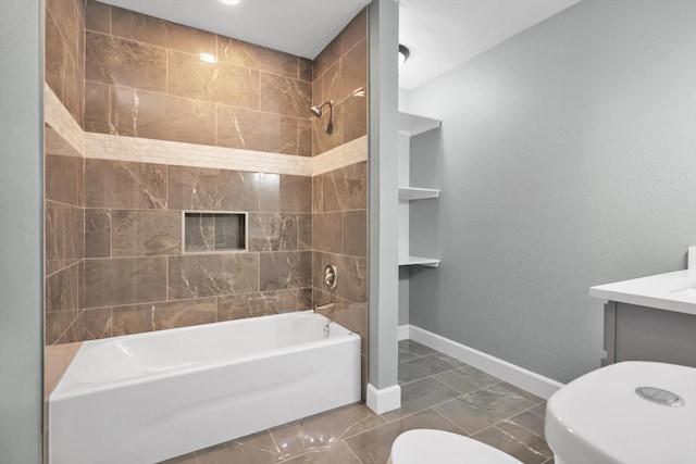 full bathroom featuring toilet, vanity, baseboards, marble finish floor, and tub / shower combination