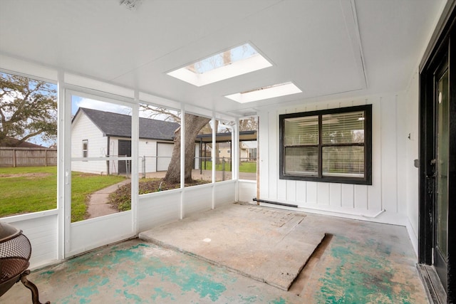 unfurnished sunroom with a skylight and plenty of natural light