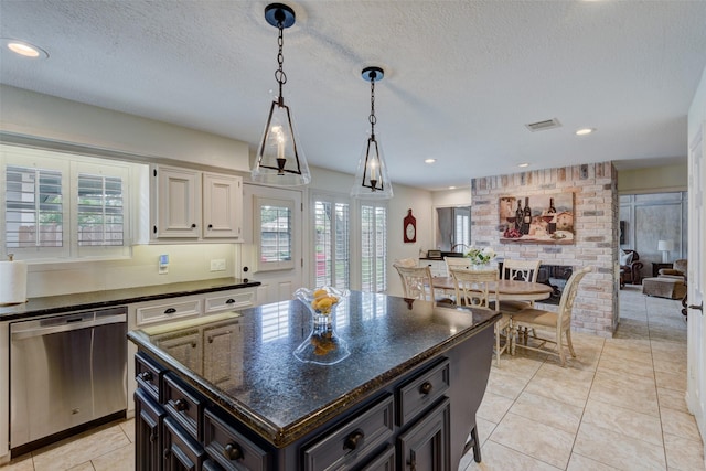 kitchen with dishwasher, hanging light fixtures, light tile patterned floors, and plenty of natural light