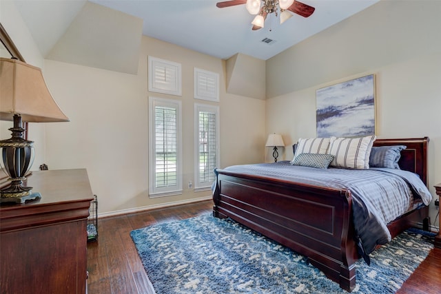 bedroom featuring a ceiling fan, baseboards, visible vents, and hardwood / wood-style floors