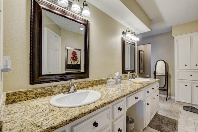 bathroom featuring double vanity and a sink