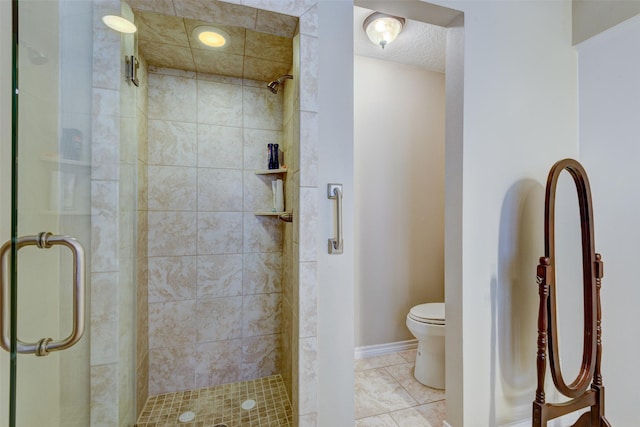 bathroom featuring a textured ceiling, tile patterned flooring, toilet, baseboards, and a shower stall