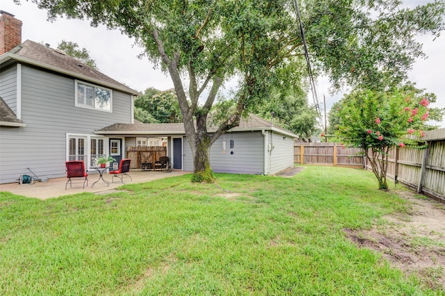 view of yard with a fenced backyard and a patio