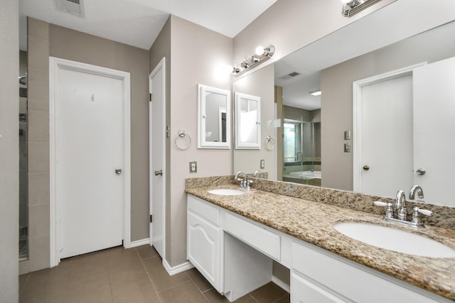 full bathroom featuring tile patterned flooring, a sink, and visible vents