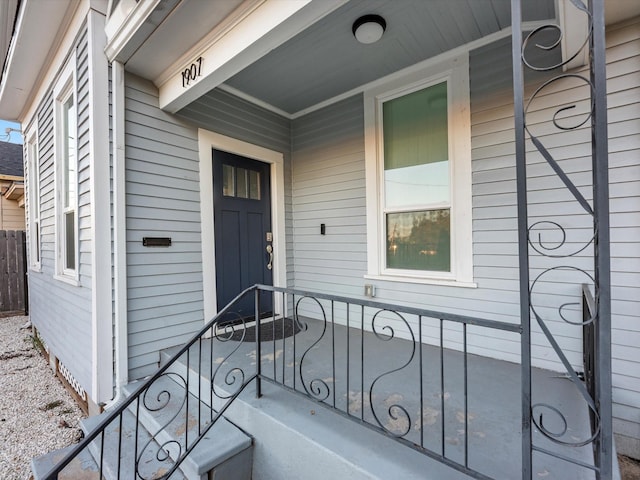 property entrance featuring covered porch