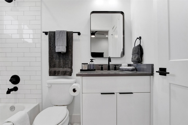 full bathroom with shower / bathtub combination, vanity, and toilet