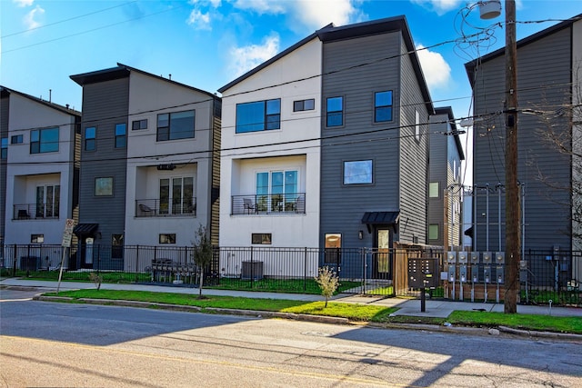 view of property with fence