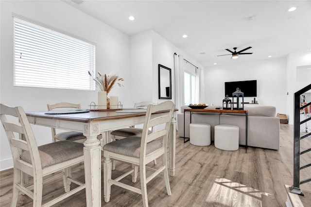 dining area featuring light wood-style floors, a wealth of natural light, and recessed lighting