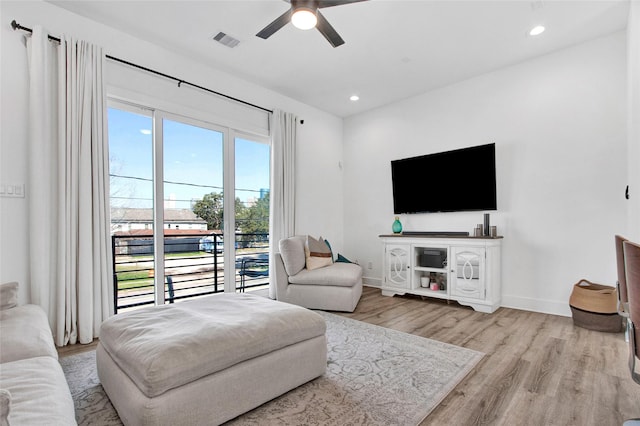 living area with recessed lighting, visible vents, ceiling fan, wood finished floors, and baseboards