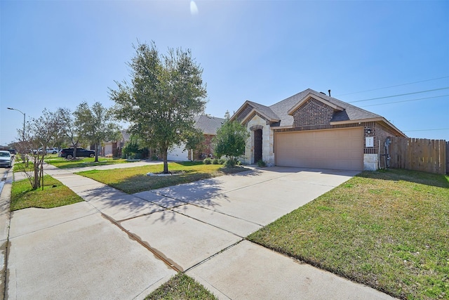 view of front facade featuring a garage, brick siding, stone siding, concrete driveway, and a front lawn