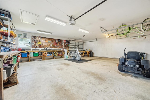 garage featuring a workshop area and a garage door opener