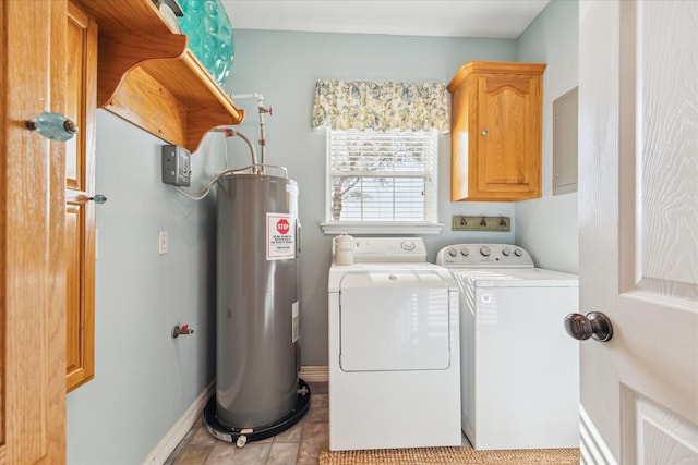 clothes washing area with water heater, cabinet space, washing machine and dryer, light tile patterned flooring, and baseboards