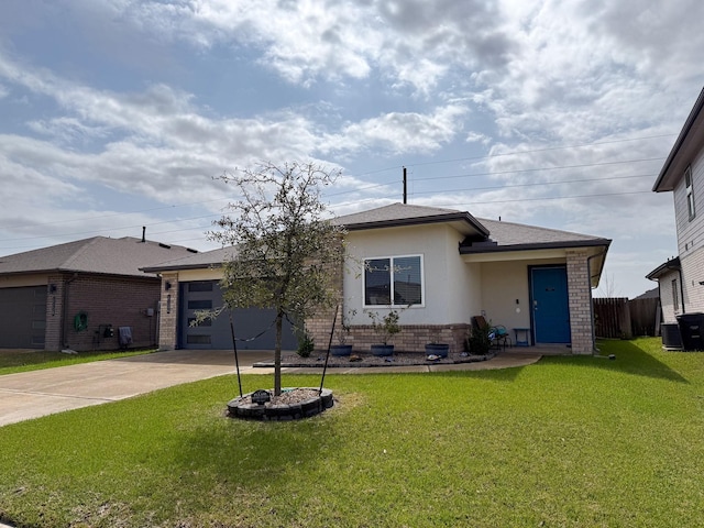 view of front of home with brick siding, stucco siding, concrete driveway, a garage, and a front lawn