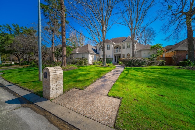 view of front of house with a front lawn and stucco siding