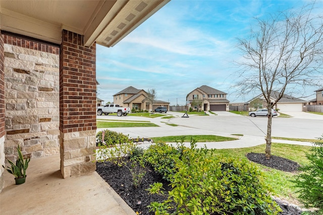 view of yard featuring a residential view