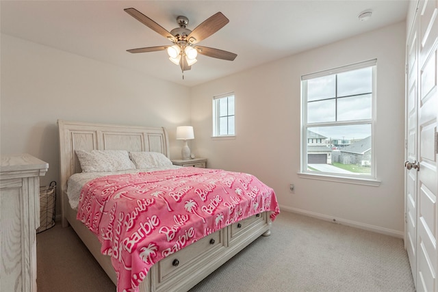 bedroom with carpet flooring, ceiling fan, and baseboards