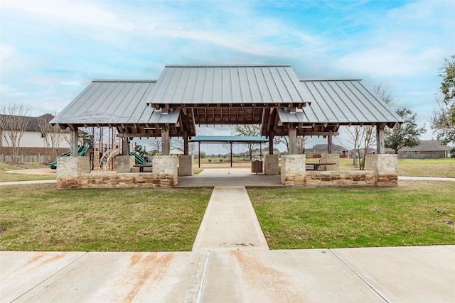 view of property's community featuring a gazebo, a yard, and playground community