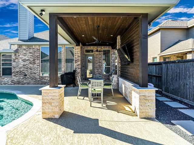 view of patio featuring ceiling fan, a fenced backyard, and a grill