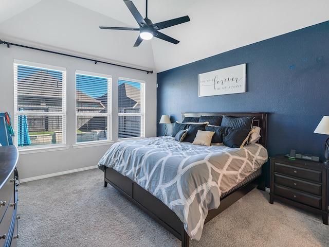 bedroom featuring carpet, ceiling fan, lofted ceiling, and baseboards