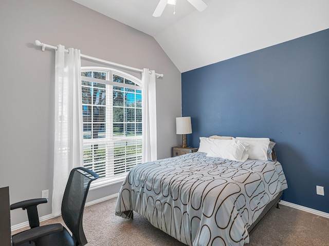 carpeted bedroom featuring ceiling fan, baseboards, and vaulted ceiling