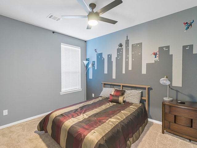 carpeted bedroom with ceiling fan, visible vents, and baseboards