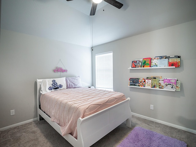 carpeted bedroom with lofted ceiling, ceiling fan, and baseboards