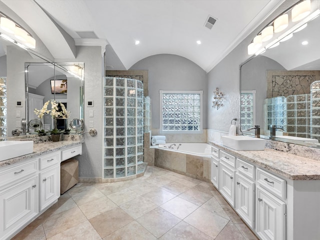 7714 Hertfordshire Dr, Spring, TX 77379 - full bathroom featuring a walk in shower, vanity, a bath, and vaulted ceiling