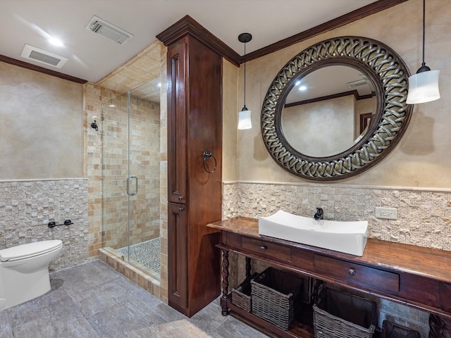 7714 Hertfordshire Dr, Spring, TX 77379 - bathroom with tile walls, a shower stall, toilet, vanity, and wainscoting