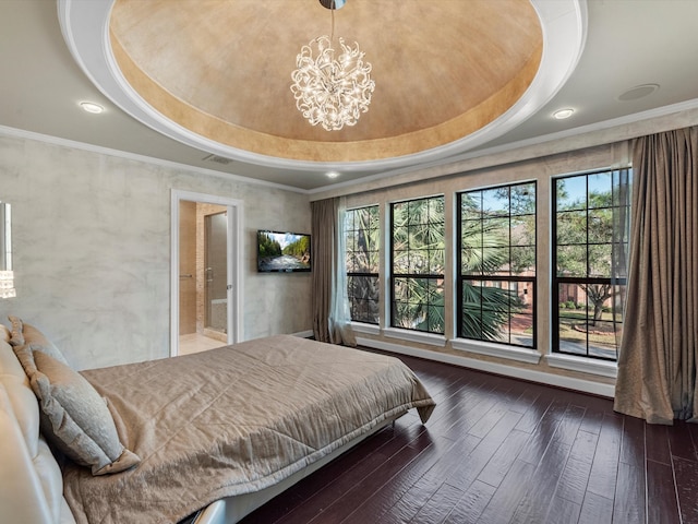 bedroom with visible vents, a raised ceiling, wood-type flooring, ornamental molding, and a chandelier