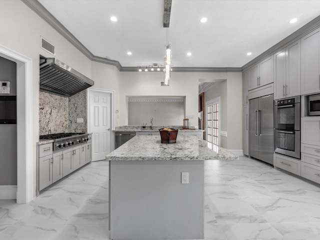 kitchen with gray cabinets, marble finish floor, crown molding, and built in appliances