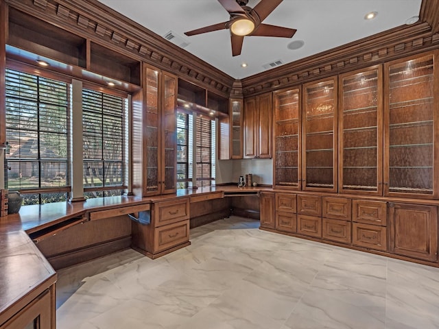 7714 Hertfordshire Dr, Spring, TX 77379 - unfurnished office featuring built in study area, ceiling fan, healthy amount of natural light, light marble finish floors, and ornamental molding
