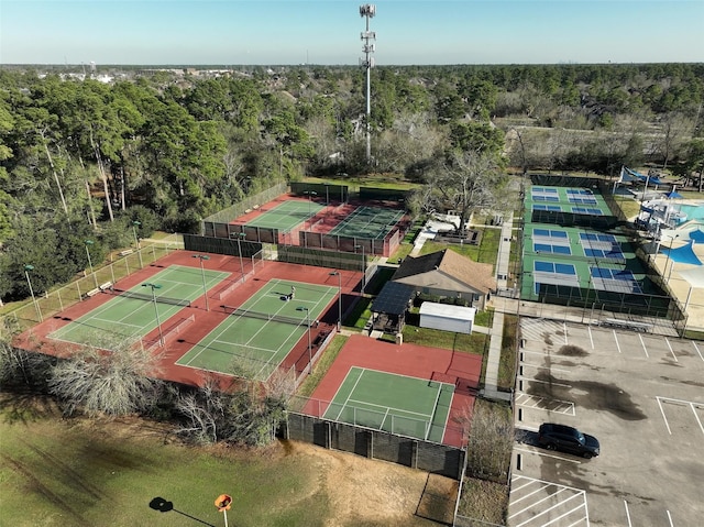 birds eye view of property with a forest view